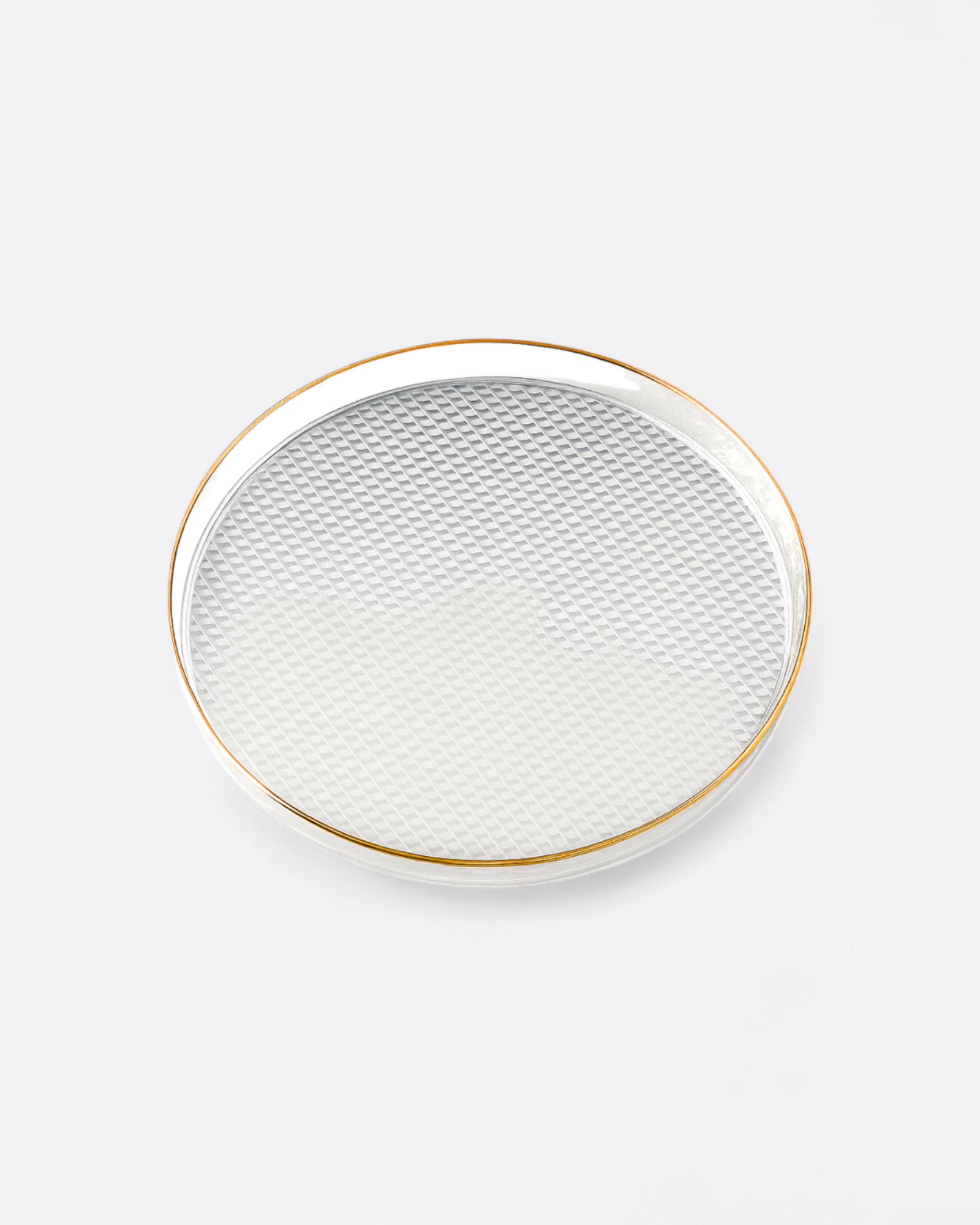 Plateau rond transparent avec bordure dorée