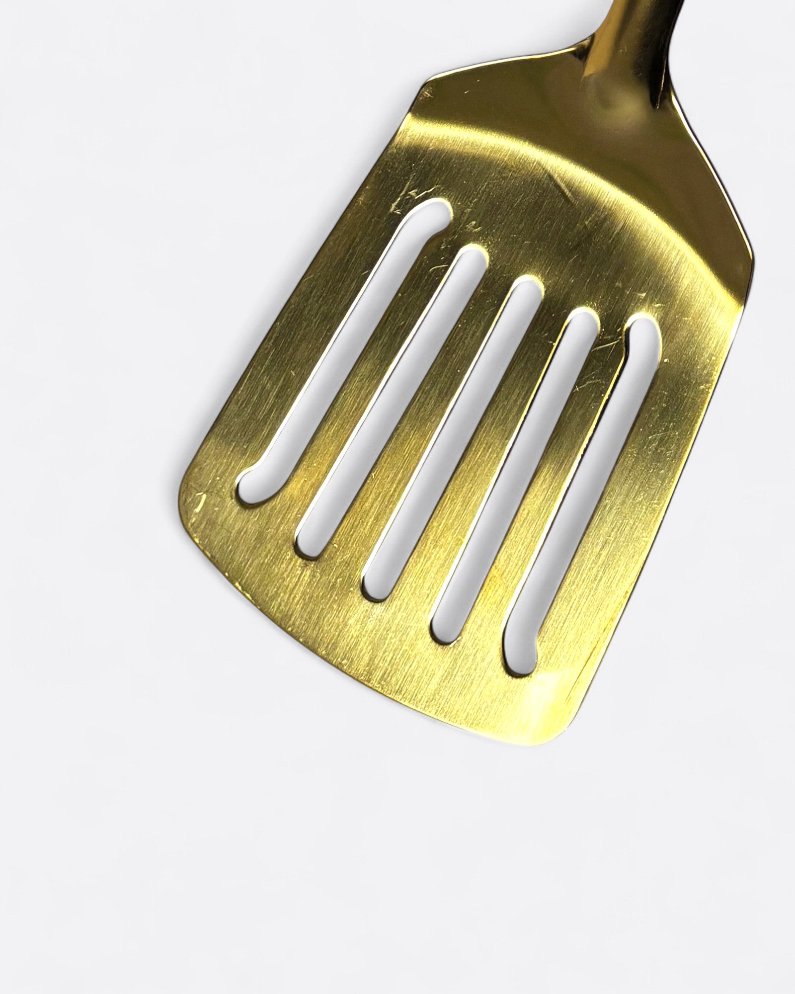 Petite spatule trouée en inox doré