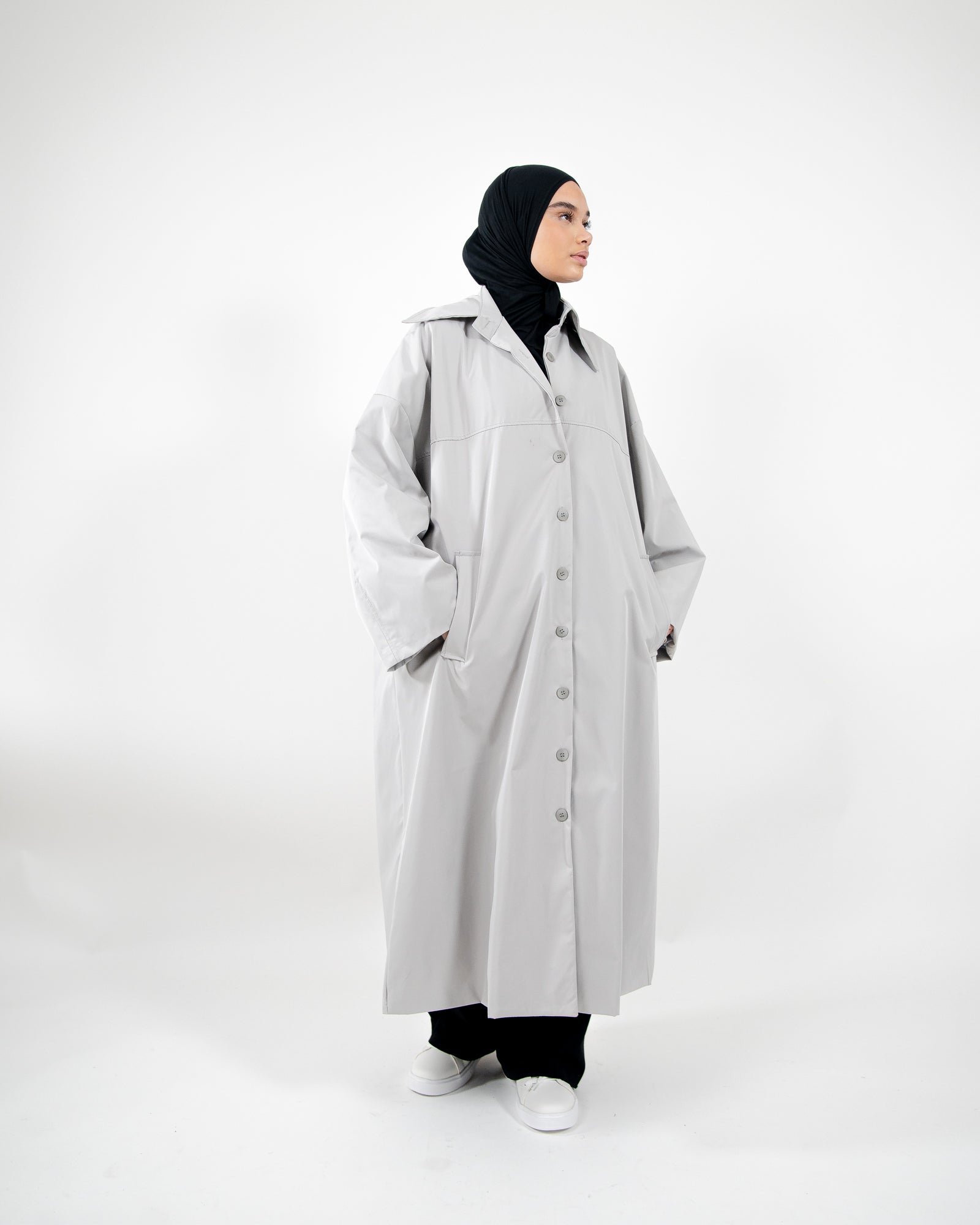 Parka larga, extragrande e impermeable con cierre de botones