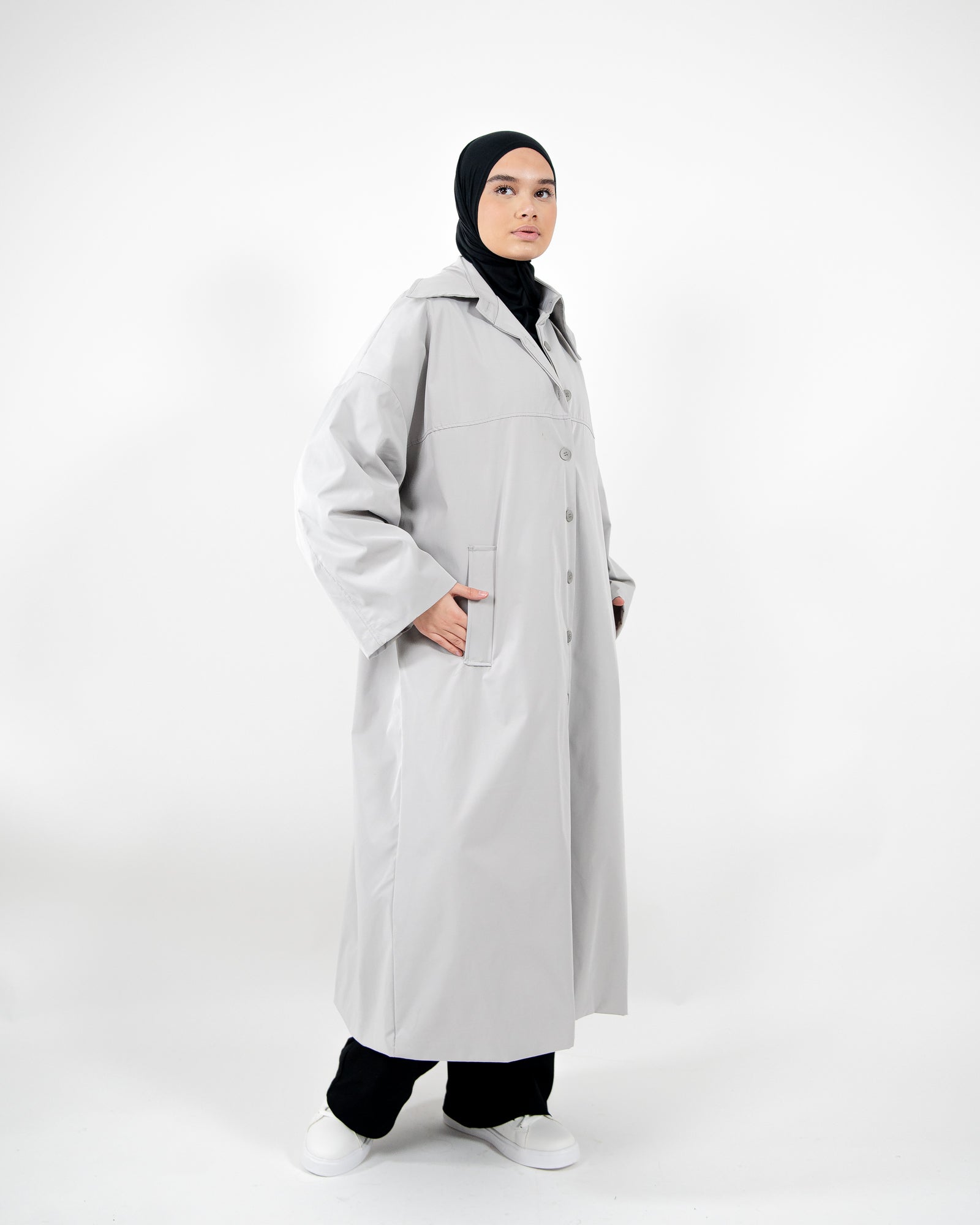 Parka larga, extragrande e impermeable con cierre de botones