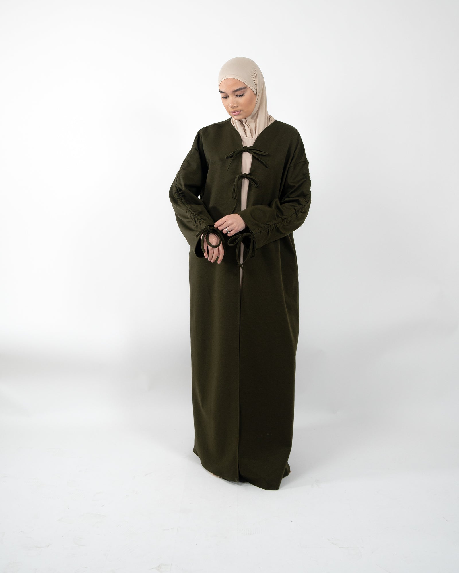 Gilet long et épais avec nœud de fermeture et manches à lacet