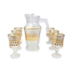 Service à eau et jus à motifs dorés ( Carafe et 6 verres à pied)