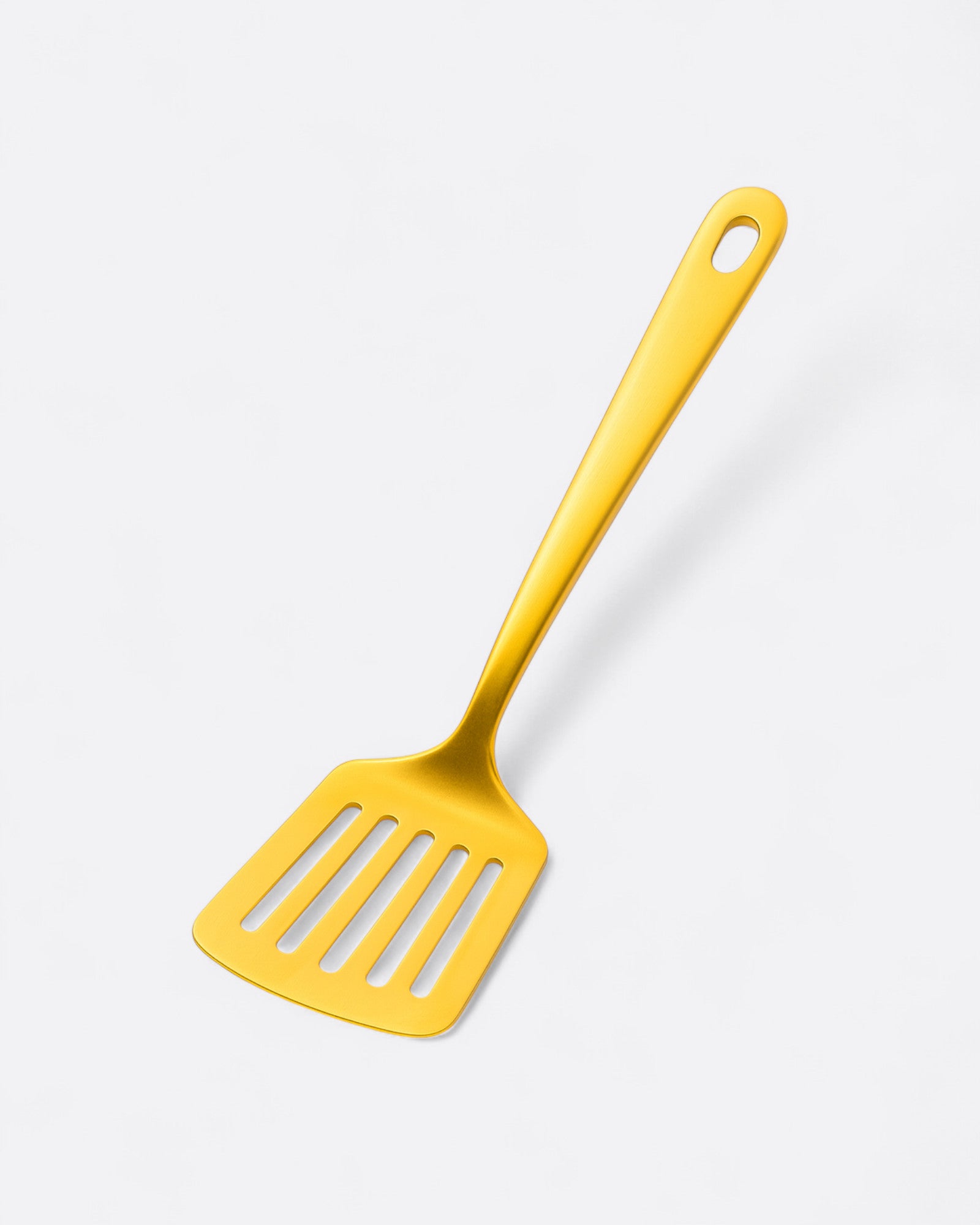 Petite spatule trouée en inox doré